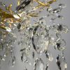 Вишукана золота люстра DIAMINA з кришталевим камінням Ø 60 см