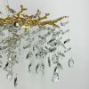Видовжена золота люстра DIAMINA з кришталевим камінням Ø 120 см